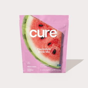 Package of Cure Electrolyte Drink Mix in Watermelon flavor with a watermelon image on a pink background
